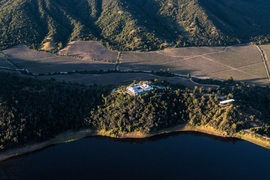The Millahue vineyard from above, with the reservoir and VIK Chile on the hill
