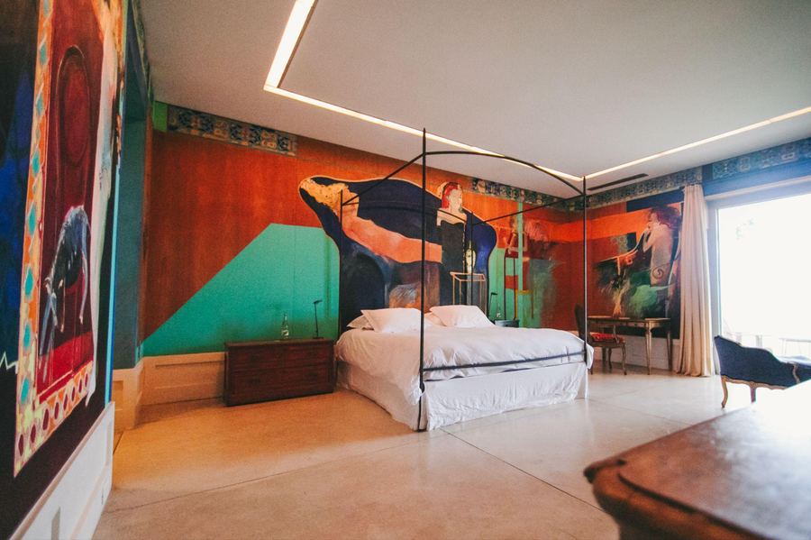 Musso Suite at Estancia Vik, with a mural in blue, orange and turquoise