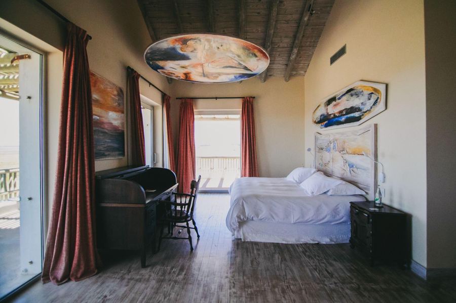 Master Suite Seveso at Estancia Vik, with a painted ceiling above the bed