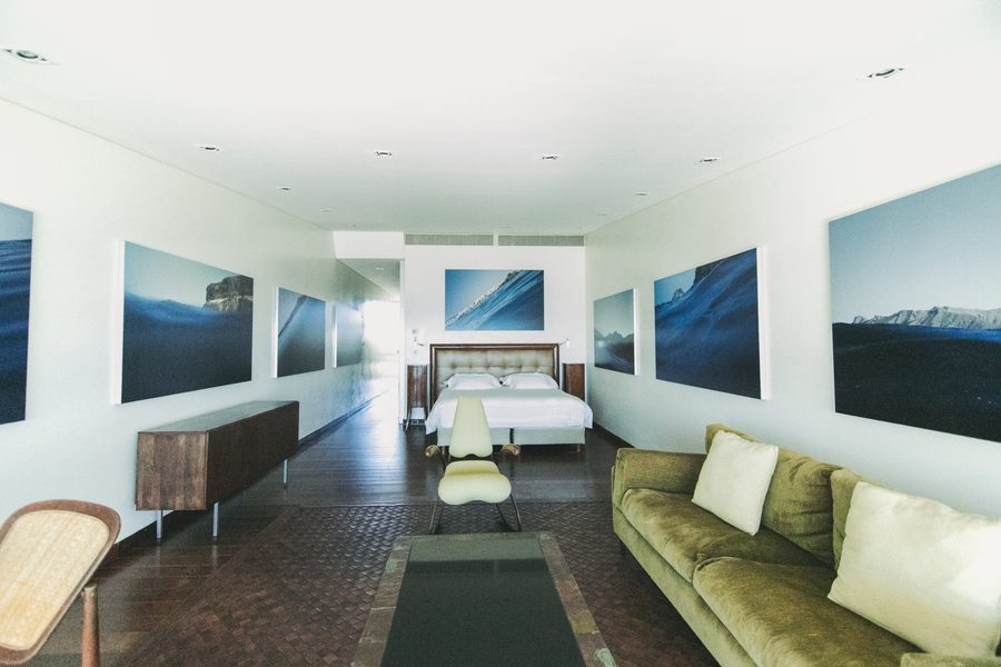 Fuerteventura Suite at Playa Vik, with photographs of the sea and a green sofa